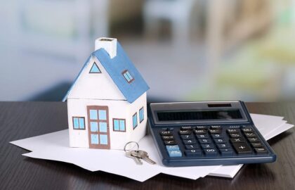 Image of a house and calculator
