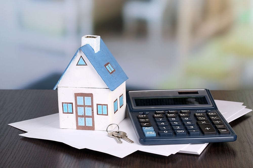 Image of a house and calculator