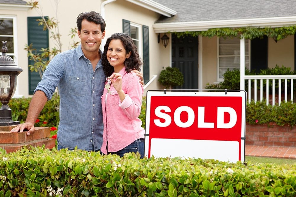 Image of a couple standing outside their sold Parkside property