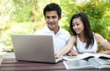 A couple looking at their computer together