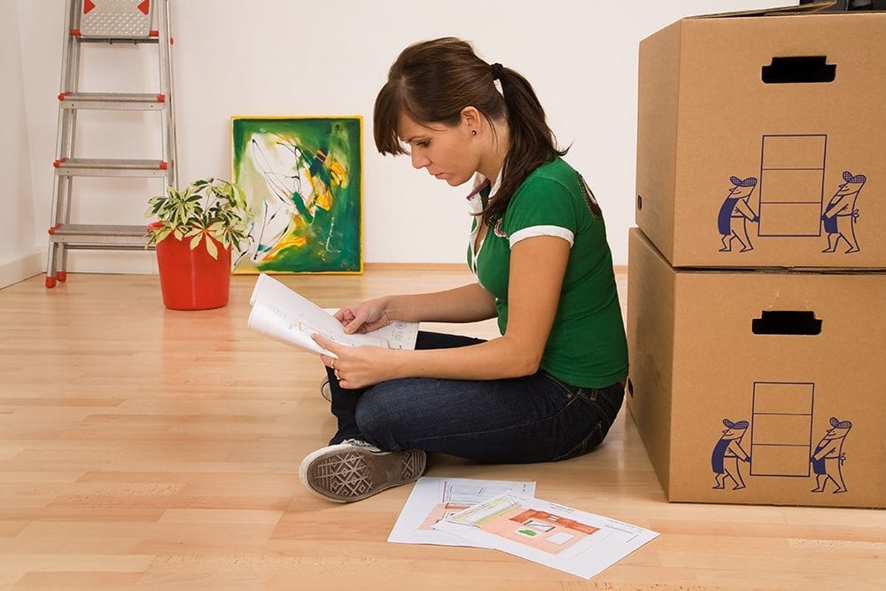 An image of a woman planning her packing