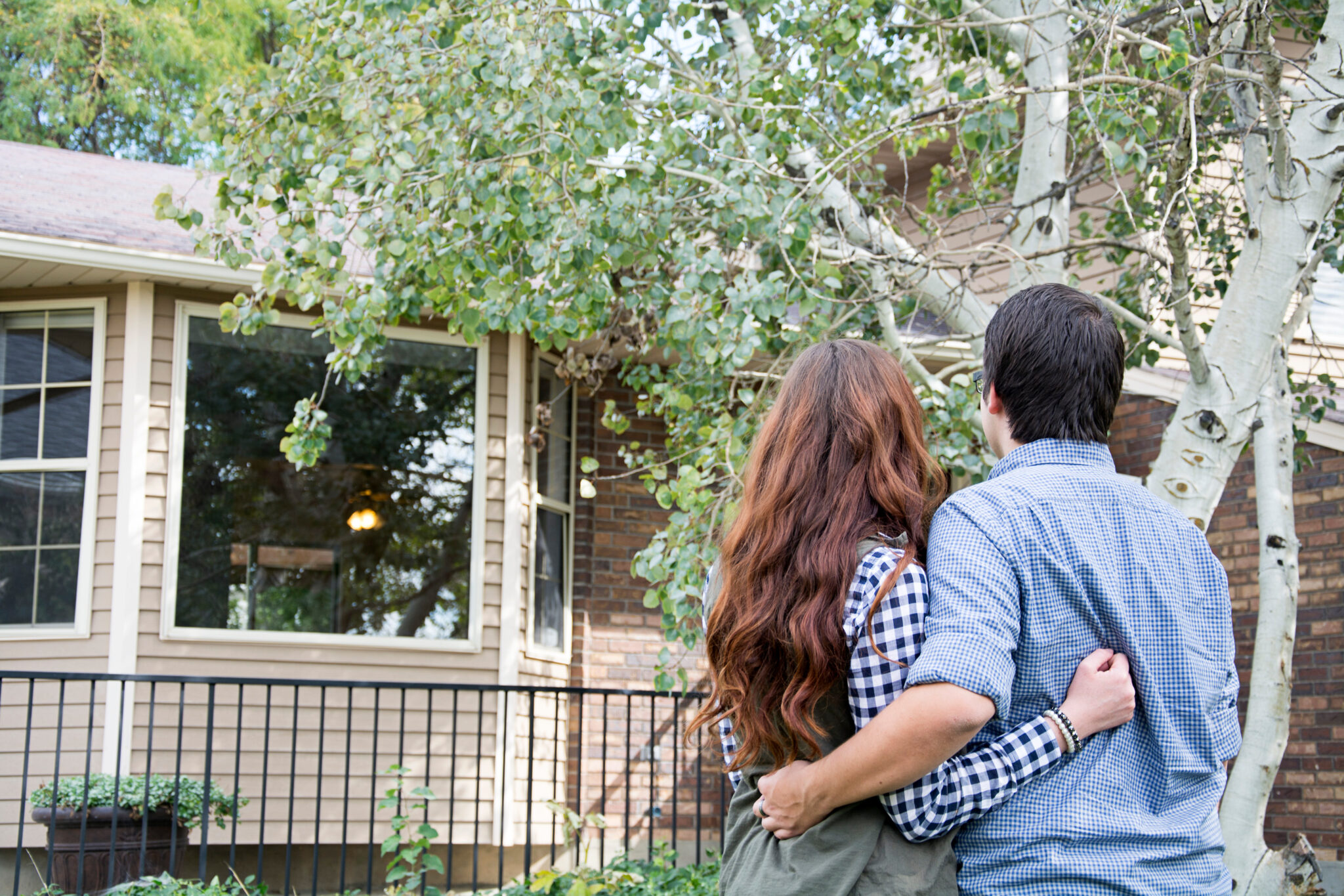 Couple looking at exterior of Sydney house